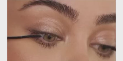 a close up of a woman's eye with a mascara